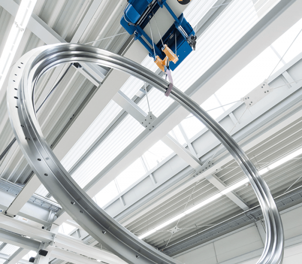 Lifting of large rotary bearing in manufacturing facility